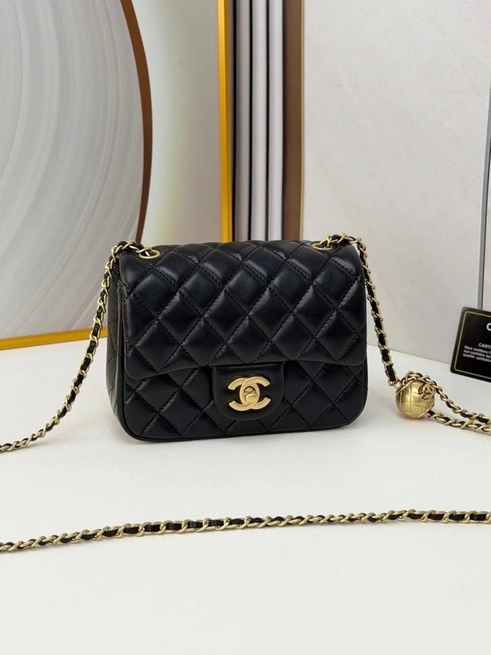 CHANEL Black Quilted Mini Crossbody Bag with Gold Hardware